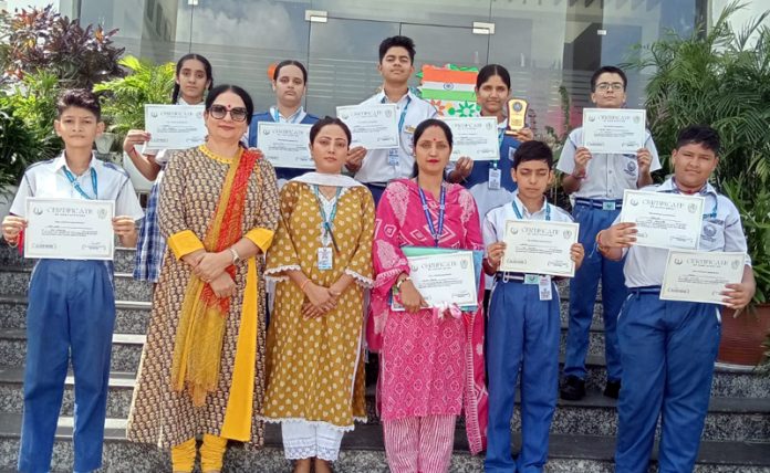 Teaching faculty of Jammu Sanskriti School posing along with students.