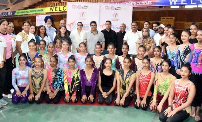 Coaches and gymnasts pose together on 1st day of Advanced Training Program which commenced at Srinagar on Saturday.