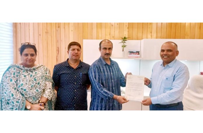 Ranjeet Kalra receiving appointment letter from Chief Electoral Officer of J&K, Pandurang K. Pole.