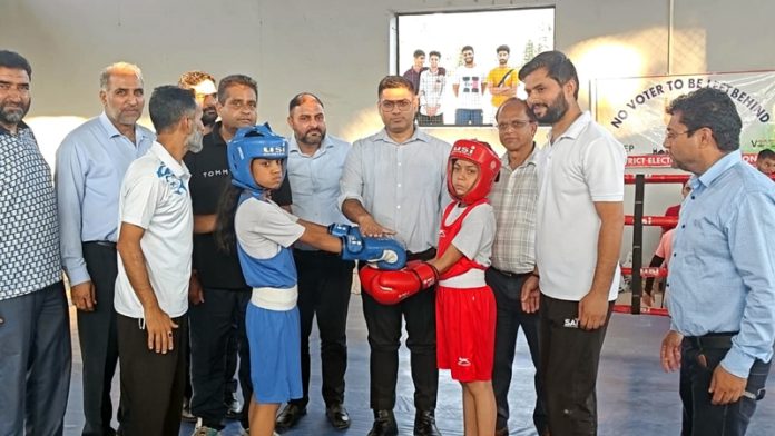 Vikas Kundal, District Election Officer of Poonch posing along with young boxers.