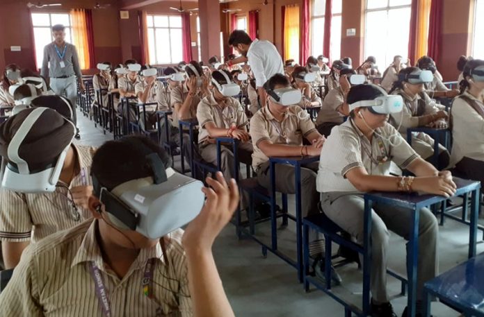 Students taking experience of Metaverse technology during a programme.