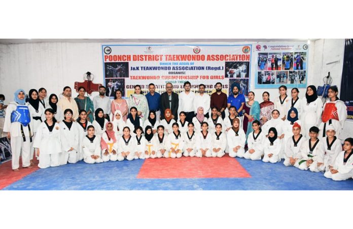 Sanjeev Kumar Chadha, Additional Secretary Ministry of Women and Child Development, Government of India posing along with Taekwondo players at Poonch.