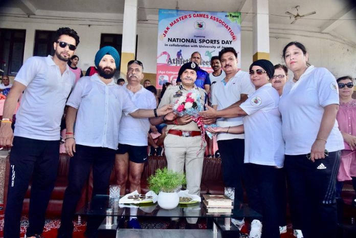 Organizers presenting bouquet to chief guest DIG J&K Police Shiv Kumar Sharma.