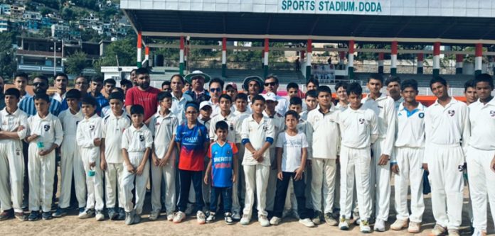 Dignitaries along with youngsters posing during cricket coaching camp at Doda.