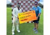 Shubham Khajuria receiving a cheque of Rs 10000 for man of the match award.