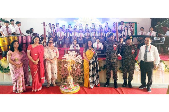 Students and teaching faculty posing during the anniversary programme at APS Akhnoor.