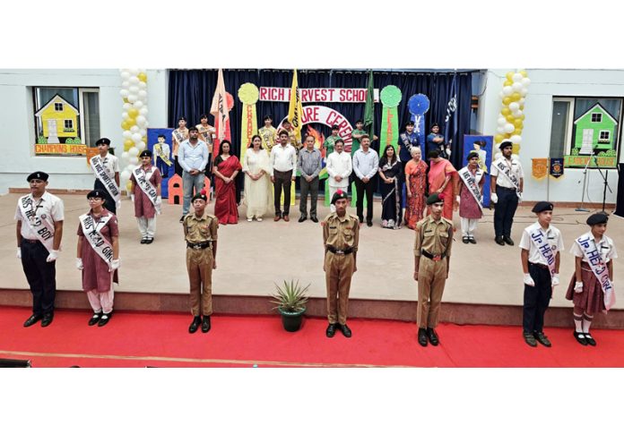 Newly elected students council of Rich Harvest School posing along with dignitaries.