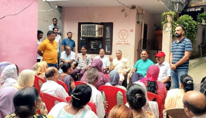 Sat Sharma listening to public grievances at Krishna Nagar in Jammu on Tuesday.