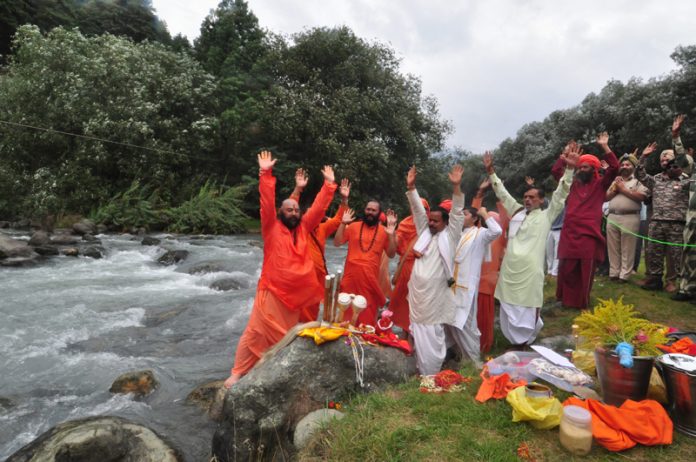 Visarjan (immersion) ceremonies being performed by Mahant Deependra Giri Ji and Sadhus at the bank of river Lidder, Pahalgam on culmination of annual Amarnath pilgrimage on Wednesday.