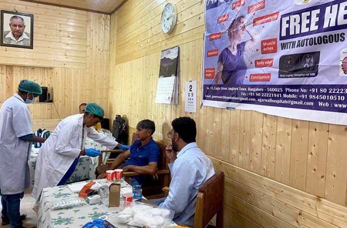 Doctors from Dr Agarwal Hospitals during a free health camp at Excelsior's Srinagar Bureau office on Friday -Excelsior/Shakeel