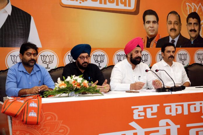 BJP national spokesperson R P Singh flanked by party leaders from J&K at a press conference at Jammu on Friday.