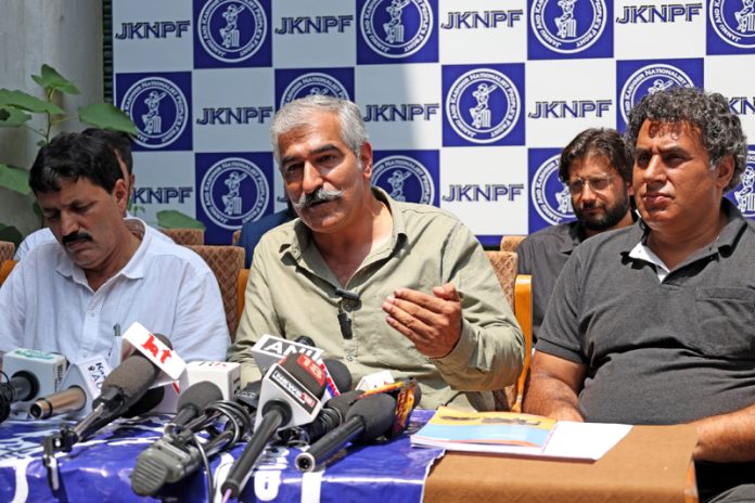 JKNPF President Muneer Ahmad Khan, along with other party leaders during a press conference in Srinagar on Monday. — Excelsior/Shakeel