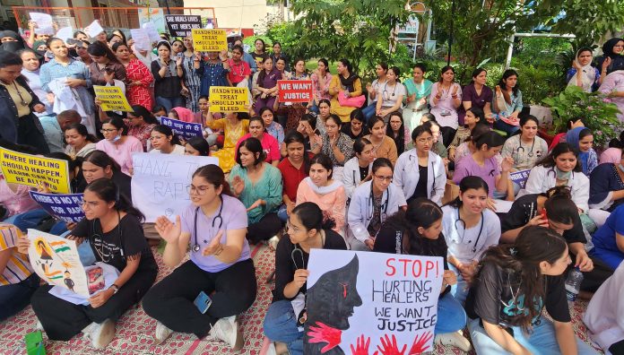 Junior doctors staging a sit-in protest in the premises of GMC Jammu on Friday. -Excelsior/Rakesh