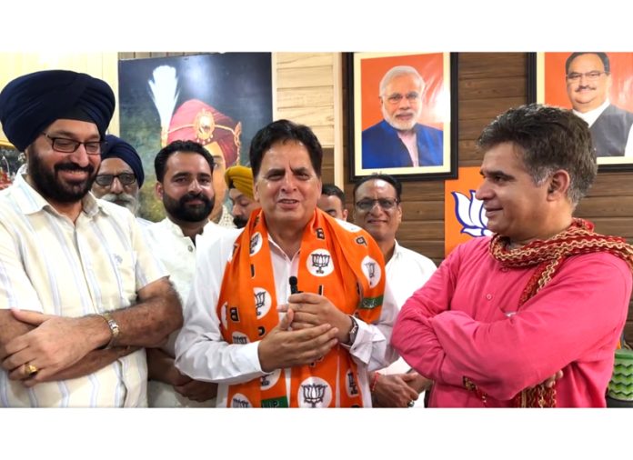 BJP president Ravinder Raina welcoming Sayeed Mureed Shah who joined the party at Jammu on Tuesday.