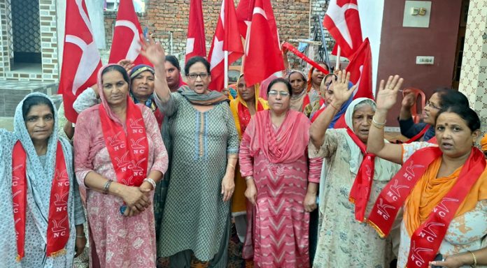 NC women wing state vice president, Bimla Luthra along with women workers at village Plata of Jammu district.