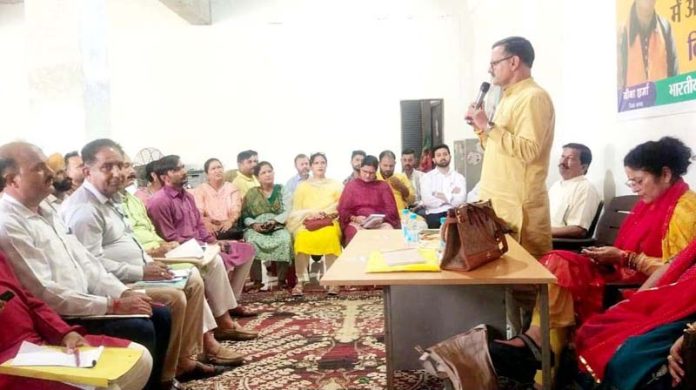 Senior BJP leader Sanjay Baru addressing party workers in Nowshera on Thursday.