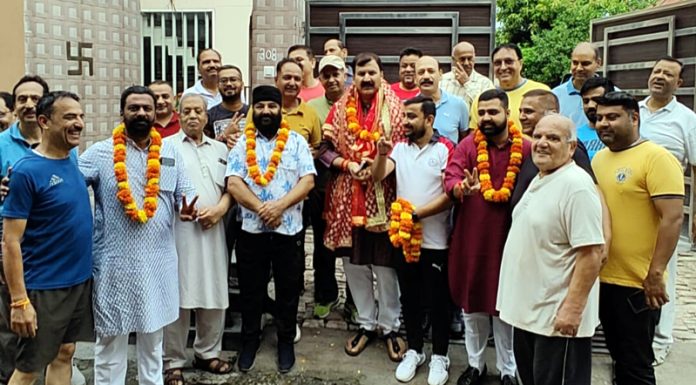 BJP candidate from Jammu West, Arvind Gupta during door to door campaigning on Friday.