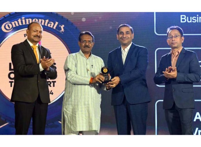 Dr. Anand Sankeshwar, MD of VRL Logistics Limited receiving an award in Jammu on Wednesday.