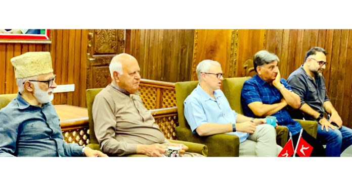 NC president Dr Farooq Abdullah, vice-president Omar Abdullah and other senior leaders hearing a delegation at party headquarters Nawa-e-Subha in Srinagar. 