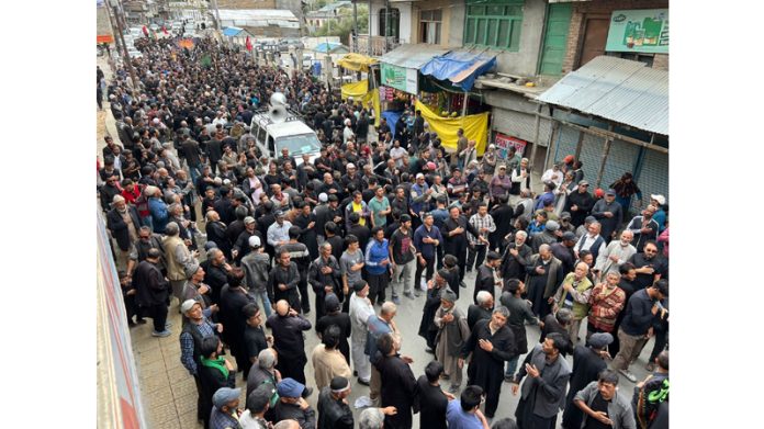 Members of JUIAK and UCL during a procession taken out in Kargil on Thursday. — Excelsior/Basharat Ladakhi