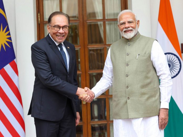 Prime Minister Narendra Modi meeting Prime Minister of Malaysia Dato’ Seri Anwar Bin Ibrahim at Hyderabad House, in New Delhi on Tuesday. (UNI)