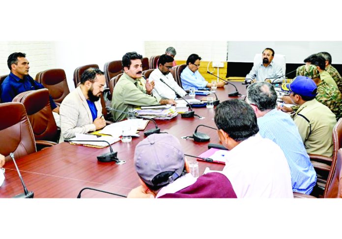 CEC Dr Mohd Jaffer Akhoon chairing a meeting in Kargil on Monday.