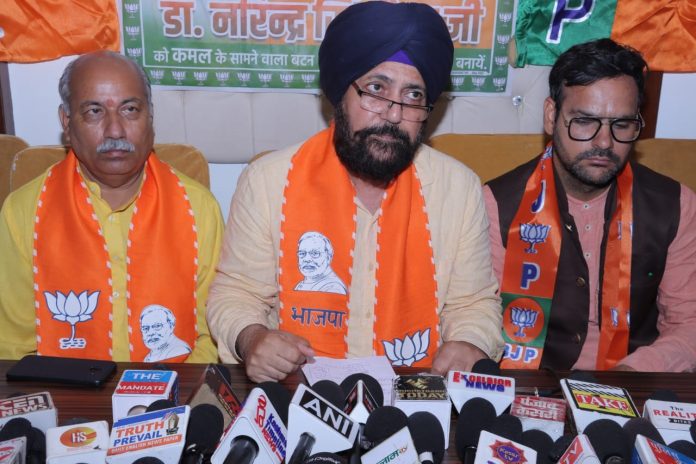 BJP candidate from Jammu South R.S Pura Constituency, Dr. Narinder Singh addressing a press conference at Jammu on Monday.