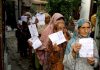 Women voters outside a Polling Station in Srinagar on Wednesday. -Excelsior/Shakeel