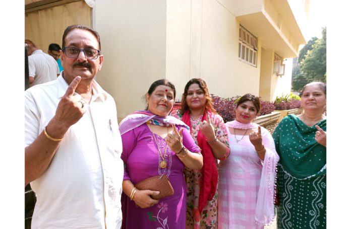 Migrant voters coming out of a polling booth at Janipur after casting their vote on Wednesday. -Excelsior/Rakesh