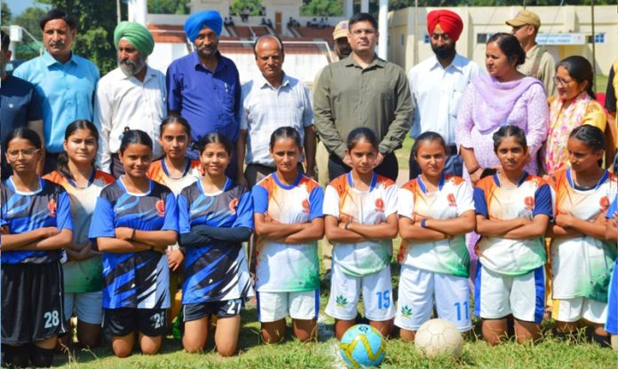 District Election Officer (DEO) Poonch, Vikas Kundal posing along with young girls.