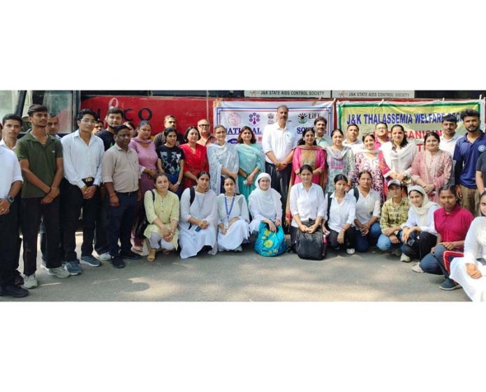 MAM College students posing with Principal and members of Thalassaemia Society during blood donation camp.