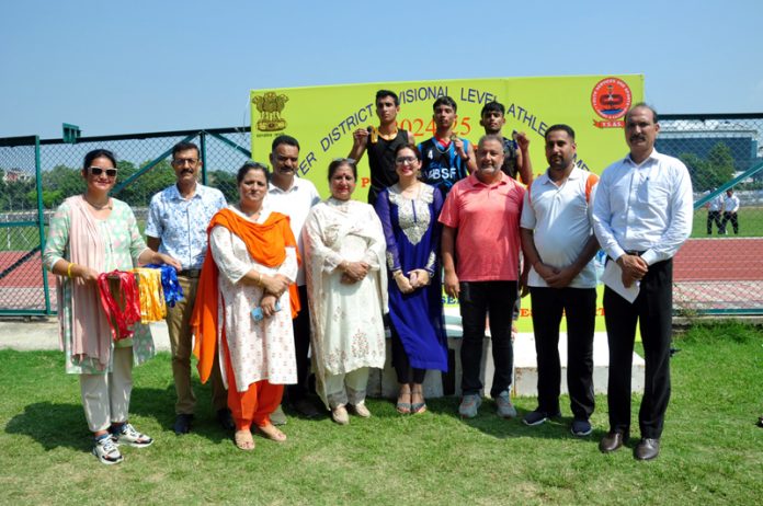 Winners of an event in Athletics posing for a photograph with dignitaries in Jammu on Tuesday.