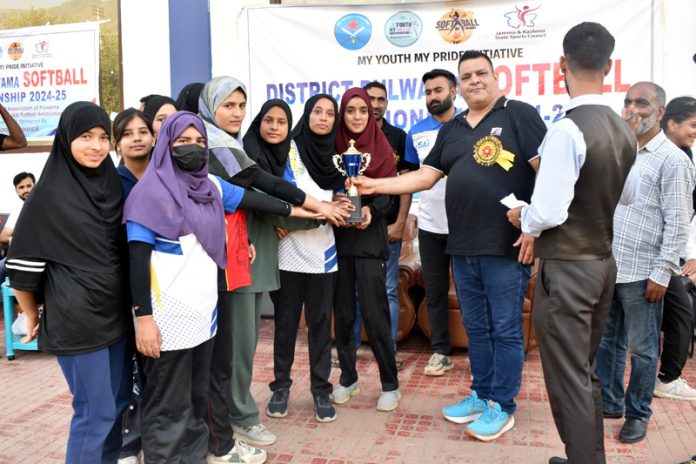 Winners of Pulwama Softball Championship 2024-25 pose for a photograph along with trophy.