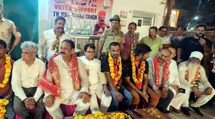 Congress MLA candidate Thakur Manmohan Singh posing with others during a rally at Bhagwati Nagar, Jammu.