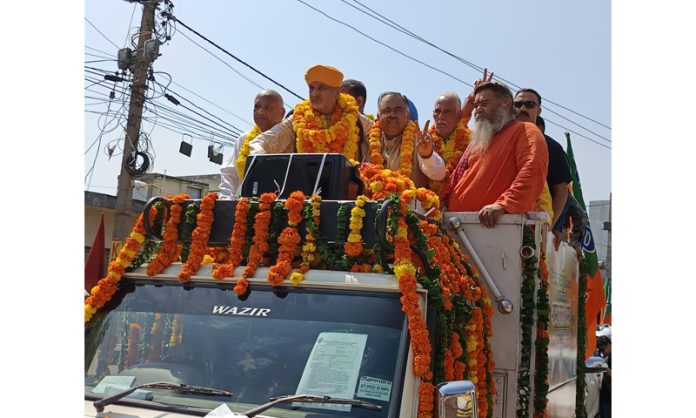 Senior BJP leader, Tarun Chugh along with party candidates while on way to file nomination papers for Assembly elections in Jammu on Monday.