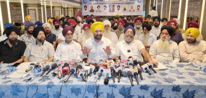 JKSCC chairman Ajit Singh flanked by others addressing press conference in Jammu. -Excelsior/Rakesh