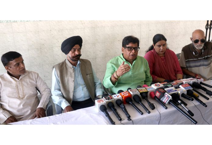 Former member of J&K SHRC, Advocate Chander Mohan Sharma addressing a press conference at Jammu. -Excelsior/Rakesh