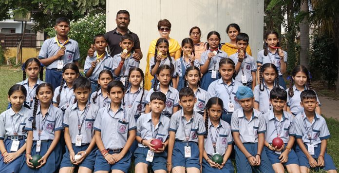 Students of S.D Tara Puri High School posing for photograph with medals they won in Inter House Raffa Boules Tournament.