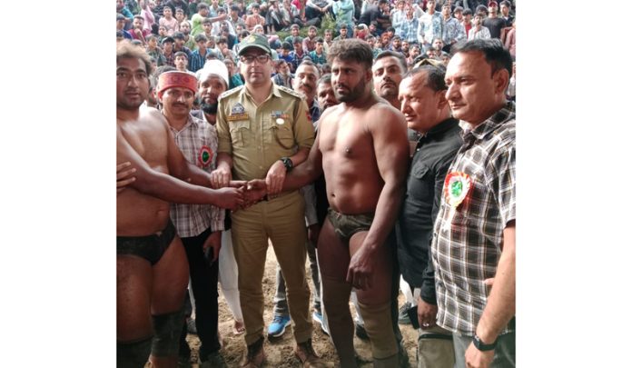 Chief guest introducing Wrestlers during a Dangal in Doda on Thursday.