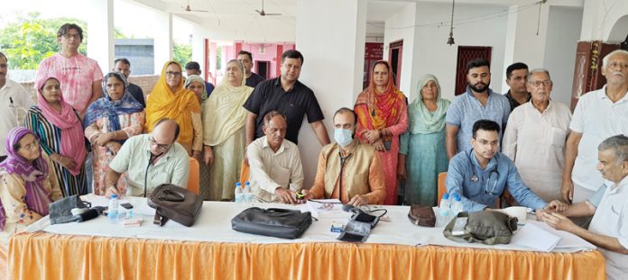 HoD Cardiology Dr Sushil Sharma examining patients at Bhalwal, Jammu on Sunday.