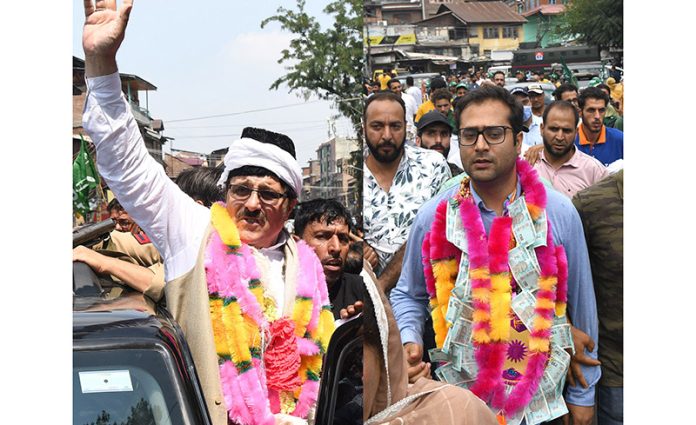 Mubarak Gul and Zuhaib Mir on way to file nomination papers in Srinagar on Monday. — Excelsior/Shakeel