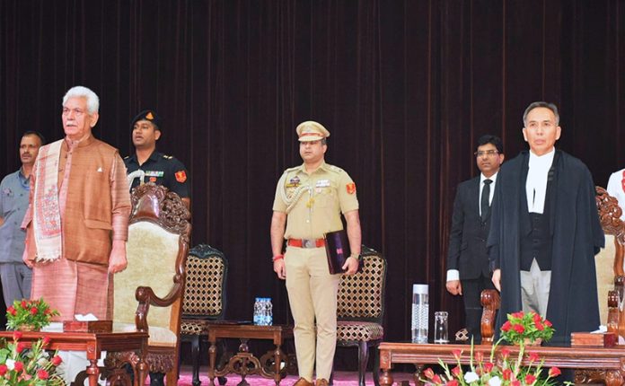 LG administering oath to Chief Justice Tashi Rabstan.