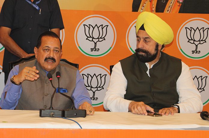 Union Minister Dr Jitendra Singh flanked by senior BJP leader R P Singh addressing a press conference at Jammu on Monday. — Excelsior/ Rakesh