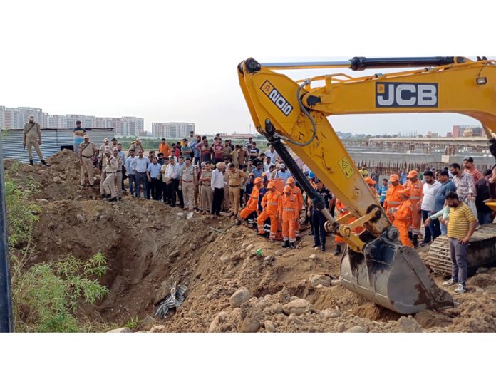 Police and NHAI team rescuing trapped labourers at Samba on Thursday.