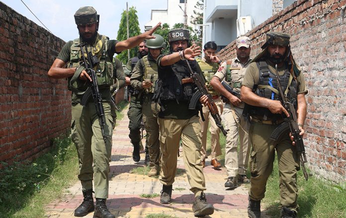 Security personnel at Sunjuwan on outskirts of Jammu City on Monday.