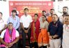 Chief Executive Officer SMVDSB Anshul Garg along with other officers posing with Sheetal Devi and Rakesh Kumar at felicitation ceremony.