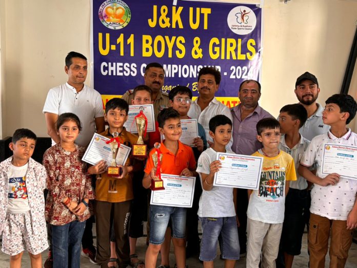 Winning players posing along with certificates.