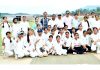 Girls Cricket team posing for group photograph.