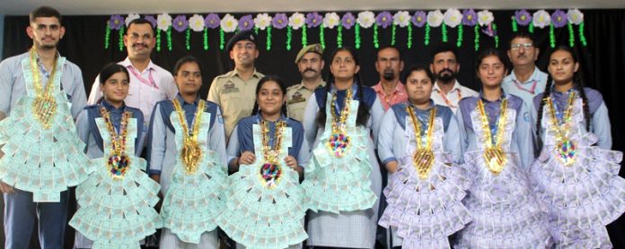 Students posing along with dignitaries during drug awareness programme. 