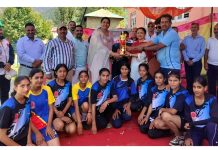 Winning team posing with trophy and dignitaries at Bhaderwah.